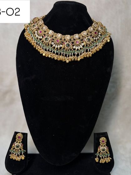 My heritage set B-02 is a classic choker with multi-color stones and pearl drops. It's a versatile piece that can be rented for weddings, receptions, or festive events.