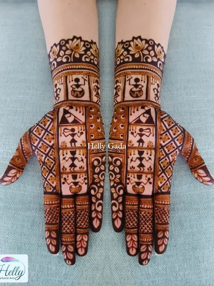 A beautiful example of Warli art integrated into a mehndi design. The simple, stick-figure-like humans and animals create a unique and culturally rich pattern.