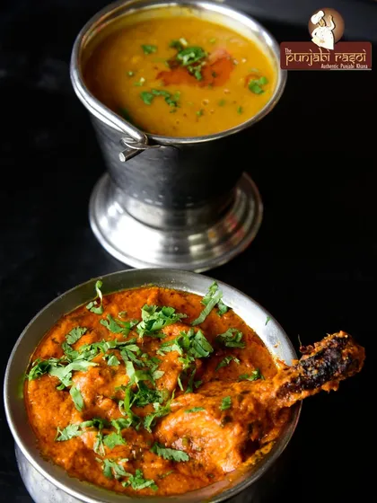 A classic Punjabi combination: a hearty chicken curry served alongside our simple and comforting Dal Tadka. A perfect meal.