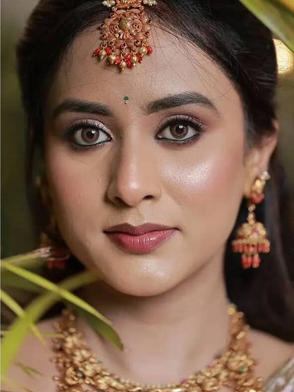 My gorgeous bride Prakruthi on her reception day. We went for a soft, romantic look with a focus on her eyes and a natural, dewy skin finish.