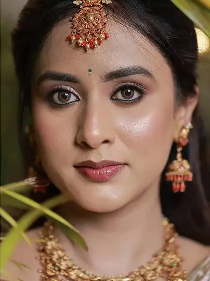 My gorgeous bride Prakruthi on her reception day. We went for a soft, romantic look with a focus on her eyes and a natural, dewy skin finish.