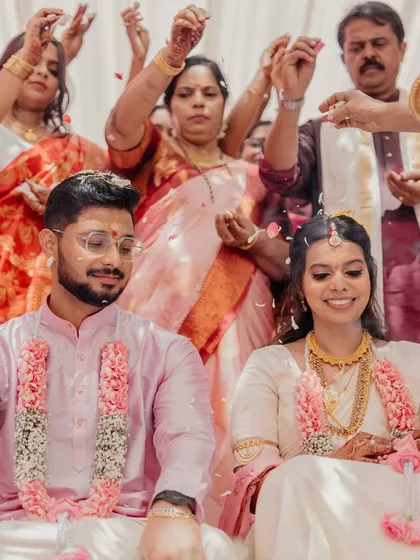 The bride and groom together, perfectly complementing each other. Her minimalist makeup looks fresh and elegant next to his simple, traditional attire.