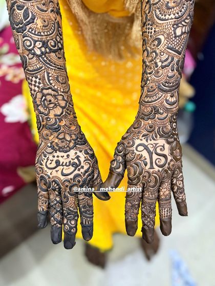 This design features the initials 'Y' and 'S' on one palm and the name 'Yusuf' in Arabic on the other.