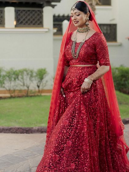 A candid walking shot shows the beautiful movement of her sequined lehenga. Her makeup stays perfect through all the action.