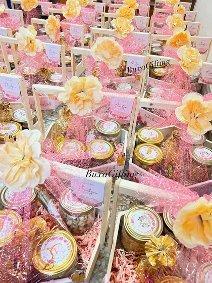 I created 65 of these vibrant hampers for a Haldi ceremony in just five days. The bright pink and yellow theme, filled with jars of snacks, chocolates, and a custom caricature of the couple, brought so much energy and joy to the celebration.