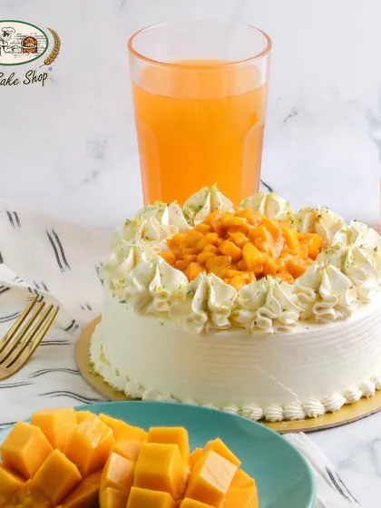 Our Fresh Mango Cake, made with diced mangoes and vanilla cream, is a refreshing and decadent seasonal treat.