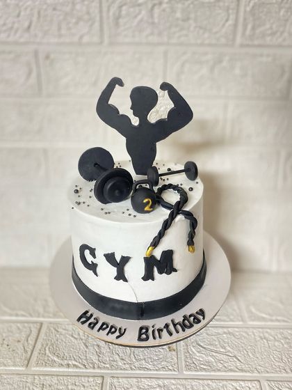 A full view of the gym-themed cake, a perfect motivator for any fitness enthusiast.