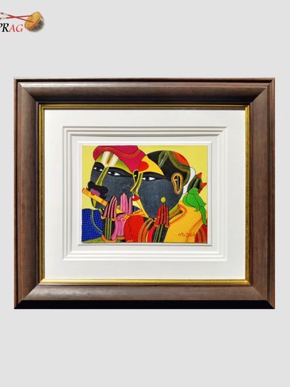 A close-up of a framed zardozi piece, showing how the deep, layered mount creates a shadow box effect. This not only looks sophisticated but also keeps the glass from touching the delicate embroidery, a key conservation practice.