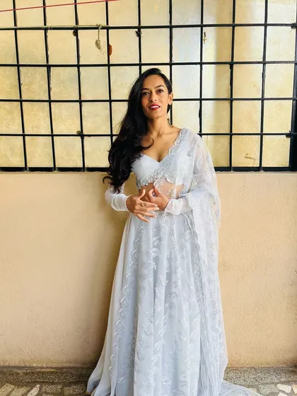 Dressed for a beautiful wedding reception in an elegant white lehenga. I adapt my style to match the tone of your event, whether it calls for timeless grace or modern glamour.