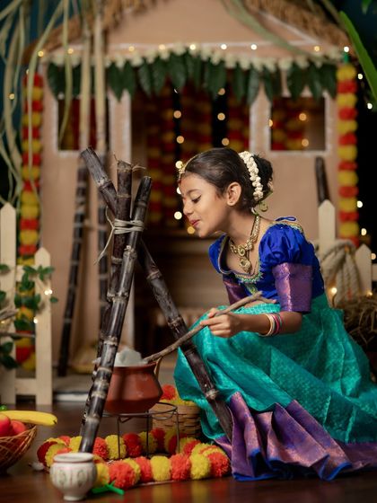 A girl tastes the sweet Pongal dish during our festive photoshoot.