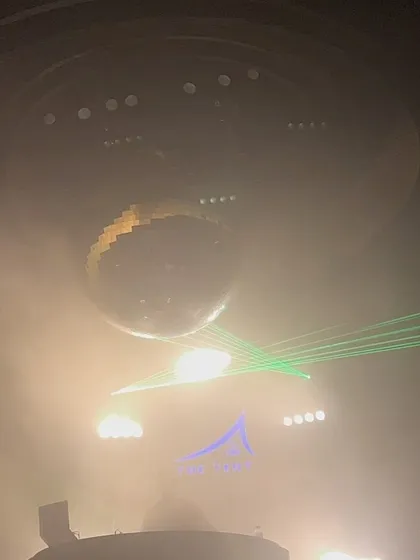A smoky, atmospheric shot with green lasers at a club in Dubai. Missing this vacation.