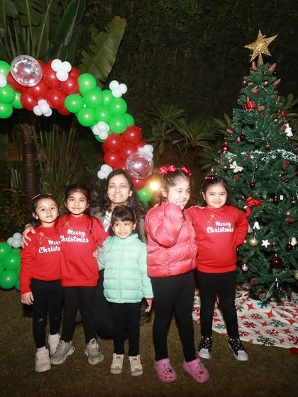 A group photo with the teacher after their successful Christmas performance. Proud moments for everyone.