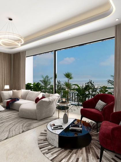 The strategic use of bold red armchairs creates a powerful focal point in this otherwise neutral living room, drawing the eye and adding a layer of dynamic energy.