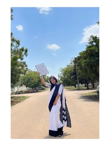 Holding my degree high from my 2022 convocation. This represents the hard work and dedication required to enter the legal profession.