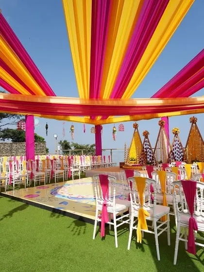 A wide view of the entire seaside Haldi setup, showing the stage, guest seating, and the stunning ocean view. We ensure every element comes together for a cohesive and beautiful event.