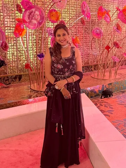 A full-length shot of my client at a wedding reception. I created a very natural and fresh "no-makeup" look that lets her beautiful floral outfit shine.