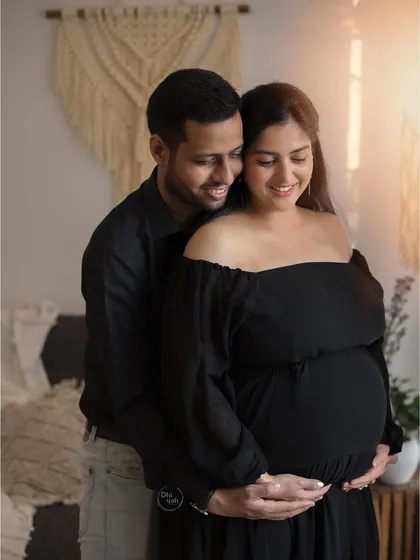 The shared smiles and gentle touch in this photo say everything. I love capturing these genuinely happy moments between couples as they celebrate the baby they are about to welcome.