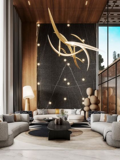 A view of a living room with a striking black feature wall and a sculptural gold light fixture. This render emphasizes our ability to create dramatic focal points within a larger open-plan space.