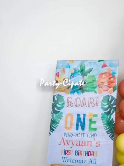 The personalized 'Roar! One' welcome sign for Avyaan's dino-mite first birthday party.