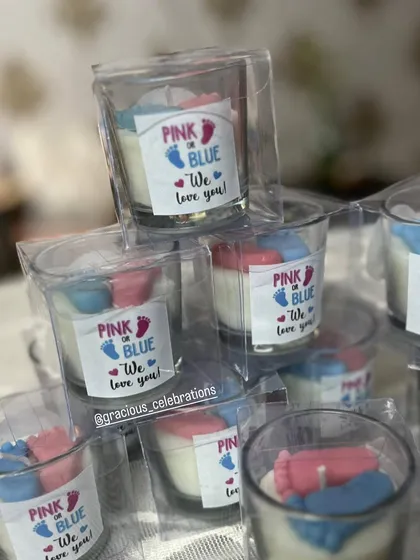 Our baby shower shot glass candles in box packaging. The custom "Pink or Blue, We Love You!" sticker makes them a perfect favor.