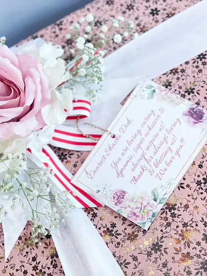 A close-up of the personalized tag and floral detail on our custom bride box, showing the care that goes into every element.