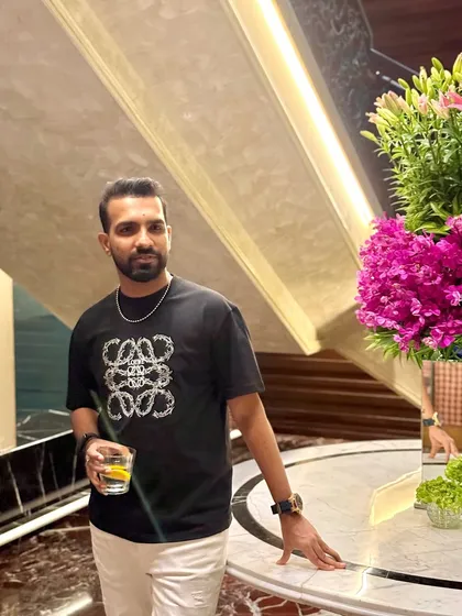Down to earth, but still above you. A casual but stylish look for a night out in Mumbai with a great city view.