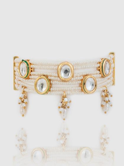 A product shot of our modern kundan and pearl choker, designed to be a versatile piece for traditional or contemporary looks.