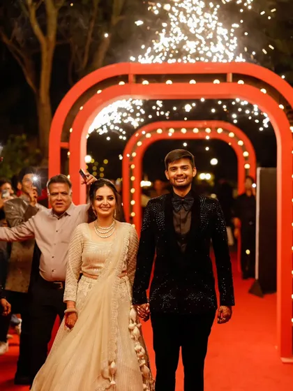 Lights, camera, action. The entrance to this Bollywood-themed Sangeet was designed to feel like a red-carpet premiere. The sparkling arches and grand walkway set the stage for a night of high-energy performances and cinematic magic.