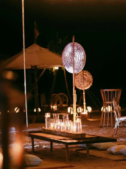 A soulful moment on the beach in Sri Lanka. This intimate wedding altar (vivah vedi) was designed with low seating, flickering candles, and earthy textures, creating a magical and harmonious setting under the stars.