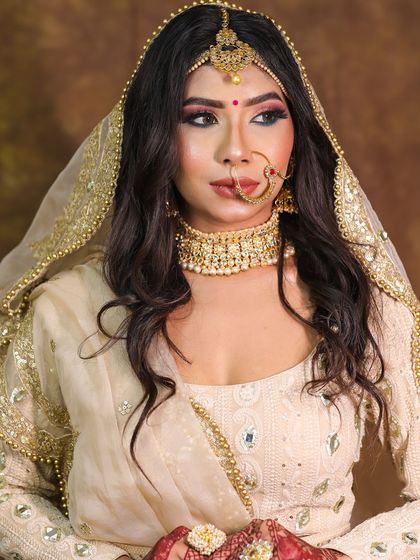 The complete look, with the dupatta perfectly draped to frame the bride's face.