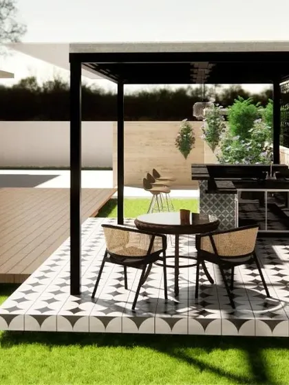 A concept for a backyard barbecue and dining area. We designed a compact outdoor kitchen under a sleek black pergola, with a tiled floor that adds a touch of classic style.