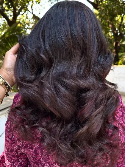 I call this creation 'Brownie + Strawberry Jam'. It's a deep brunette base with swirls of rich red, perfect for someone who wants a hint of color that's both sweet and sophisticated.