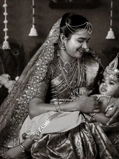 A timeless black and white portrait of a mother and child in a traditional Krishna and Yashoda theme. A beautiful way to blend culture with family love.