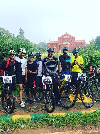 The crew gathered in front of the iconic red Attara Kacheri (High Court) building in Cubbon Park.