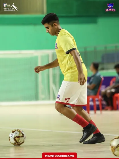 A player dribbling during the pre-match warm-up.