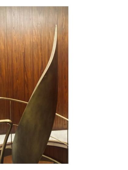 A detail of a spiral staircase, where the aged brass handrail becomes a pure, sculptural ribbon. We love these little details; the overall project is but a collection of well matched and fitted parts.