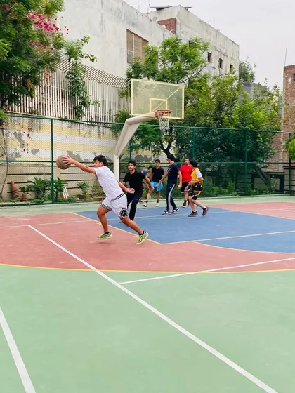 A player extends for a layup, showing great body control. We focus on finishing techniques to score effectively around the rim.