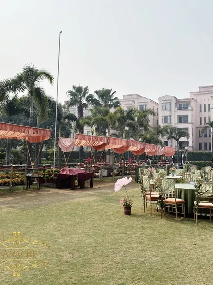 A wide shot of the event space, showing the guest seating and the food service area.