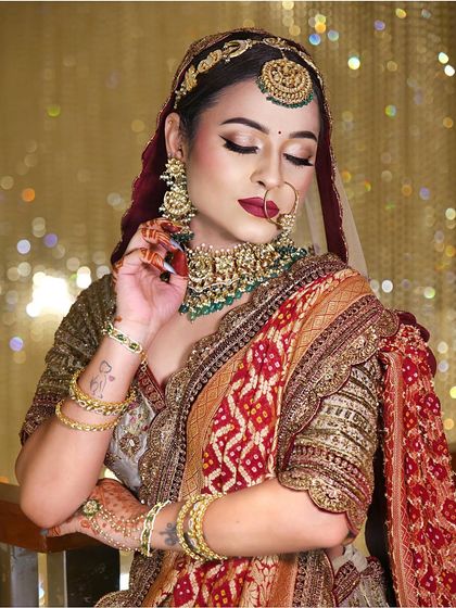 A closer look at this classic bride's makeup. The focus is on the intricate details of her eye makeup and the perfect application of her bold lipstick.