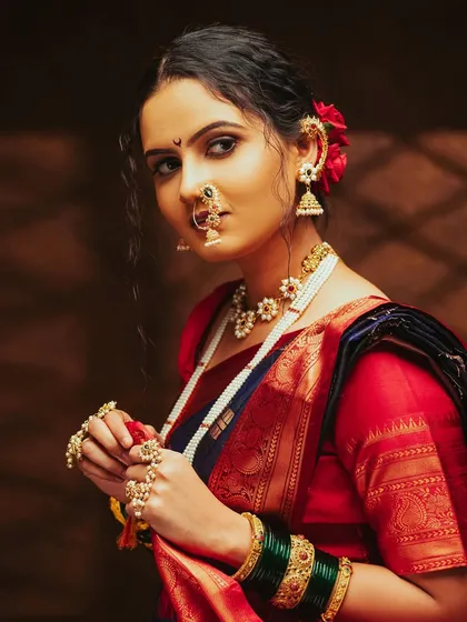 A beautiful portrait capturing the essence of a traditional Marathi look, with the nath and pearl jewellery.