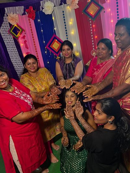 The bride and her guests celebrating together. My team and I can handle large groups, ensuring everyone gets a beautiful design for the wedding festivities.