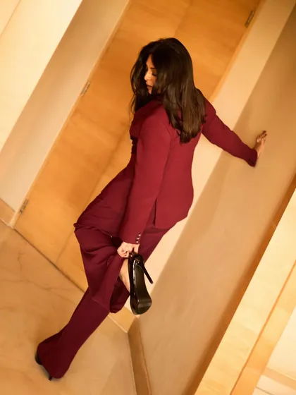 A creative, tilted shot that adds a dynamic and fashionable edge to this power suit look.