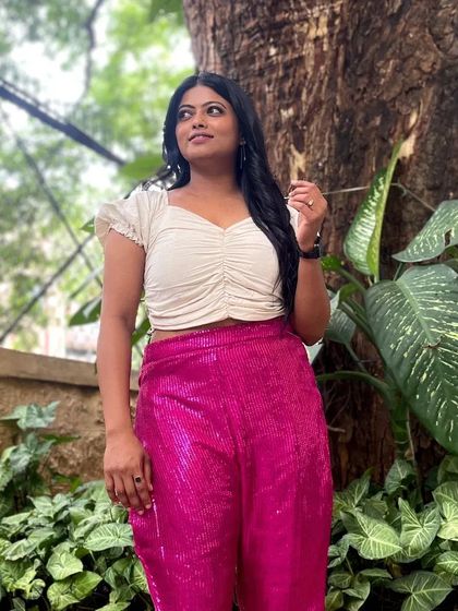 A full-length view of the sequined pants outfit. It's a fun and modern choice for someone who wants to shine.