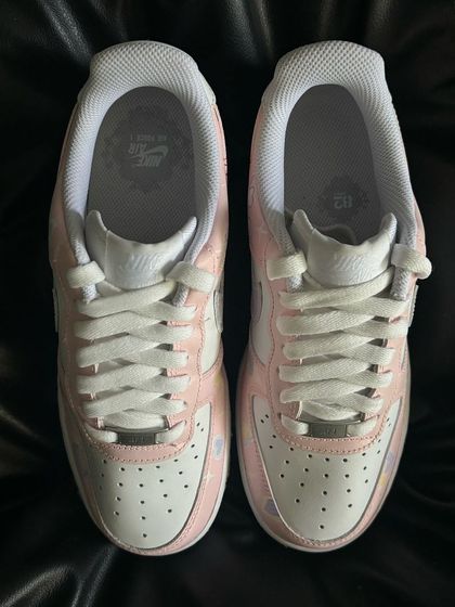 A front view of the "Lover" custom sneakers, showing the pastel color palette.