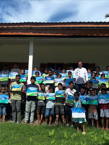My students at Gogamukh College proudly displaying the landscape paintings they created during our workshop. It is so rewarding to see them all holding their finished artwork.