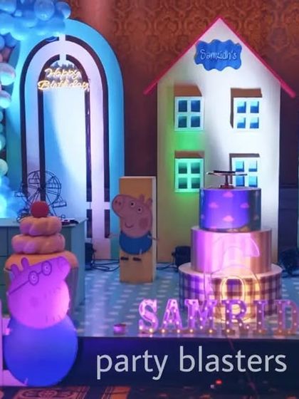 A playful Peppa Pig themed birthday party. We built a custom backdrop featuring Peppa's house and neighborhood, complete with character cutouts and a picket fence.
