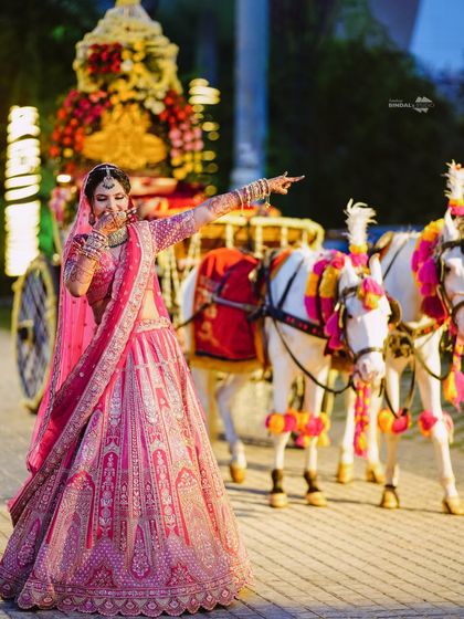 Another shot of the bride's happiness, pointing with excitement. Her energy is infectious, and I make sure to capture these expressive, candid moments.