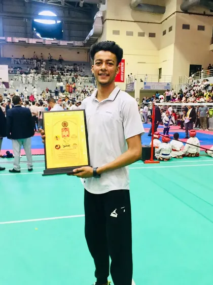 Rajat Kashyap receiving an Award of Honour for his excellence in karate at the Sansad Khel Spardha in Noida.