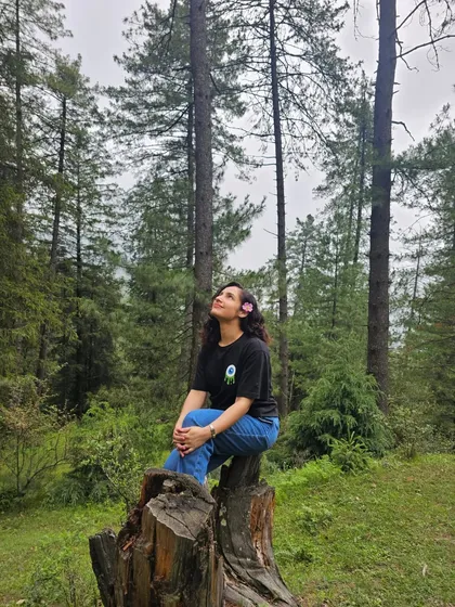 Taking a moment to sit on a tree stump in the forest and just look up. It's in these quiet moments of connection with nature that I feel most alive and grateful.