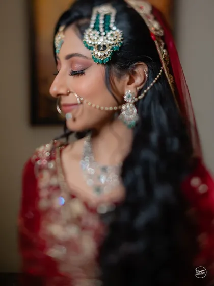 A serene close-up of the bride on her Nikaah day, capturing the delicate details of her makeup and traditional jewelry.